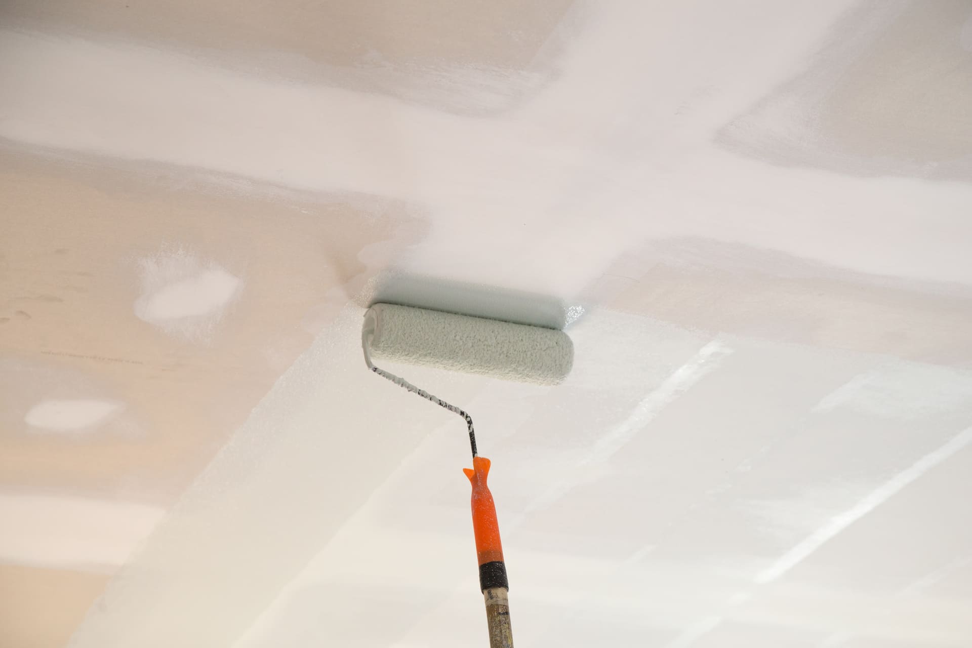 Florida homeowner repairing drywall before painting